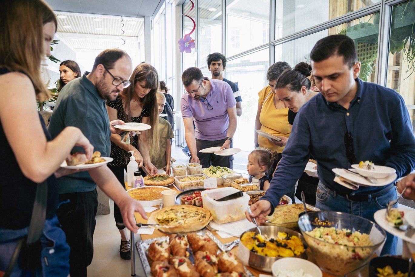 People enjoy a potluck 