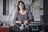 Tech researcher smiling.