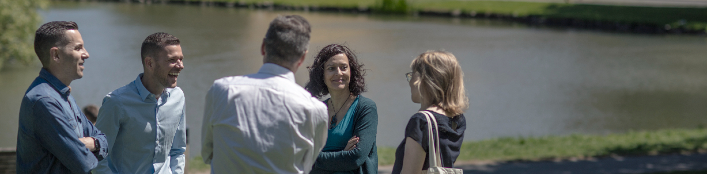 Employees talking in the University park